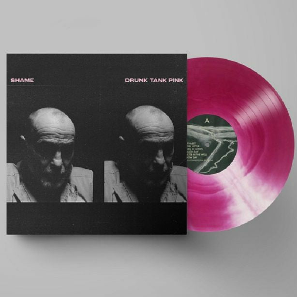Vinyl record with pink and black design and cover featuring two faces.