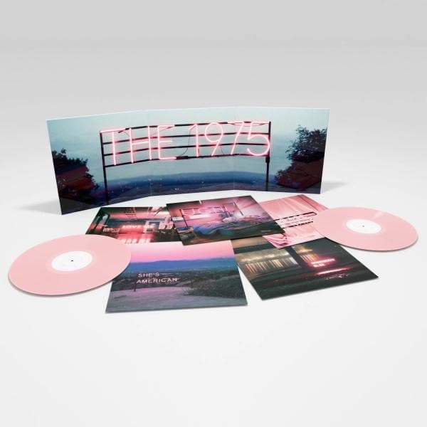 Vinyl record set with pink discs and cover featuring 'The 1975' on a white background