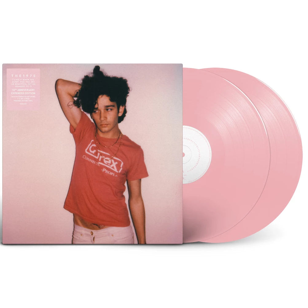 Vinyl record with a cover featuring a person wearing a red shirt on a white background