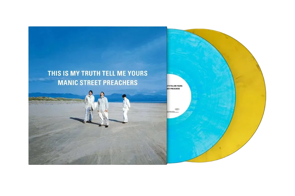 Vinyl record with a cover featuring four people on a beach and text 'This is my truth tell me yours Manic Street Preachers'.